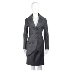 John Galliano Fall/Winter 1998 skirt suit in grey wool. Beautifully detailed bow detail to the front of the jacket. Condition Excellent Marked Size Jacket: UK 10 Skirt: UK 10 Black Clothing, Suit Black, Anna Wintour, John Galliano, Jean Paul Gaultier, Skirt Suit, Bow Detail, Vivienne Westwood, Fall Winter