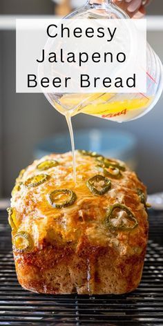 cheesy jalapeno beer bread is being drizzled with cheese