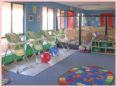 a room filled with lots of chairs and toys