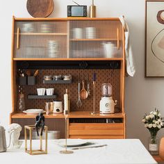 a kitchen area with wooden cabinets and white counter tops, including a coffee maker on the shelf