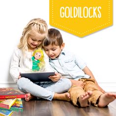 two children sitting on the floor looking at an electronic device with text overlay that reads goldilocks