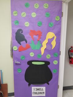 a door decorated with paper cutouts and words