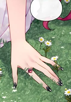 a woman's hand with black fingernails and nail polish on it in the grass next to daisies