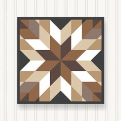 a brown, white and black square pattern is shown in the center of this wall hanging