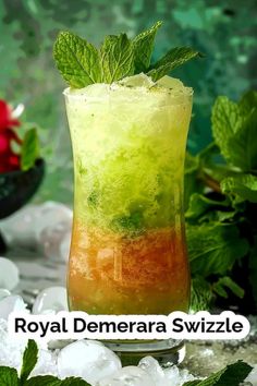 a tall glass filled with ice and mint