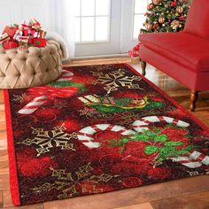 a living room with a christmas tree and presents on the rug, along with a red couch