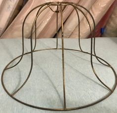 a round metal stand on top of a table