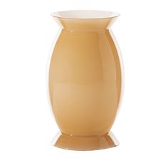 an orange vase sitting on top of a white table