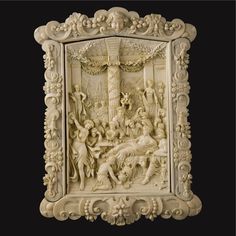 an intricately carved ivory plaque depicting the birth of jesus