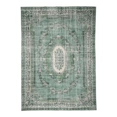 a green rug with an ornate medallion design on the center and sides, in front of a white background