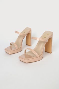 Who wouldn't be completely obsessed with the Lulus Fausee Light Nude Patent Square Toe Platform Slide Sandals! Sleek patent faux leather shapes these heels with a trendy square footbed (with a 0.5"" toe platform), a slender toe strap, and a matching vamp strap with a bit of elastic at the side. An easy-to-slide-on design tops a sky-high blade heel for a chic look! 4. 5" wrapped heel. Cushioned insole. Rubber sole has nonskid markings. All Man Made Materials. Imported. Lulus | Fausee Light Nude P Summer Patent Leather Block Heels With Sculpted Heel, Trendy Patent Leather Block Heels For Summer, Trendy Summer Patent Leather Block Heels, Trendy Patent Leather Block Heels, Summer Patent Leather Heels With Square Toe, Summer Square Toe Patent Leather Heels, Spring Heels With Square Toe In Polyurethane, Spring Heels With Square Toe Made Of Polyurethane, Spring Square Toe Heels In Polyurethane