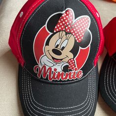 Disney Minnie Mouse Baseball Cap With Velcro Adjustable Back. New With Tags Cute Adjustable Black Baseball Cap, Fun Mickey Mouse Themed Hat One Size Fits Most, Fun Mickey Mouse Hat, Adjustable Mickey Mouse Fun Hat, Casual Black Mickey Mouse Hat, Adjustable Red Mickey Mouse Hat, Disney Baseball Hat, Cute Black Minnie Mouse Backpack, Adjustable Mickey Mouse Cap