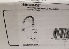 an unopened box containing the kitchen faucet and its price label is shown