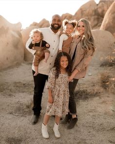 a family posing for a photo in the desert