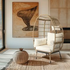 a living room with a chair and a painting on the wall