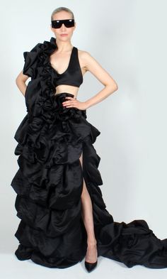 OR 4 interest-free installments of $200.00 USD by Dramatic black gown in gathered satin-finish fabric. One of a kind. Custom made by DOPE Tavio. Sizing: Fully adjustable design. Halter neckline, center back, and waist can all be let in/out to accommodate most sizes S-XL Dry clean only. Taffeta Prom Gown With Ruffles, Fitted Black Evening Dress With Satin Finish, Taffeta Evening Dress With Ruffles For Gala, Satin Gala Gown With Ruffles, Satin Gown With Ruffles For Gala, Silk Evening Gown With Ruffles, Black Gown With Satin Finish For Gala, Black Satin Finish Dress With Fitted Bodice, Elegant Voluminous Party Gown