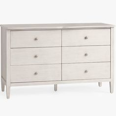 a white dresser with six drawers and two handles