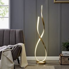 a modern floor lamp in the corner of a room