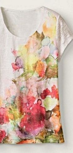 a t - shirt with flowers painted on it