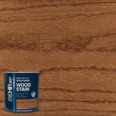 a can of wood stain sitting on top of a table