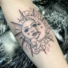 a sun and moon tattoo on the arm