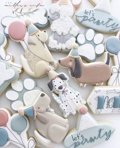 decorated cookies with dogs and balloons for a baby's first birthday or special occasion