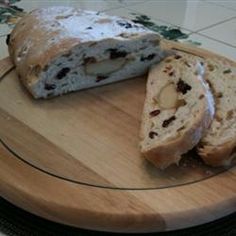 a loaf of bread sitting on top of a wooden cutting board