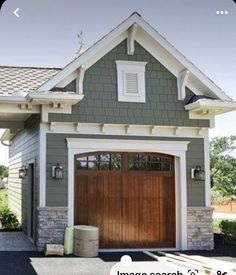 an image of a house with garage doors on the front and side windows that are open