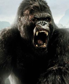 a large gorilla with its mouth wide open