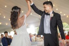 a bride and groom dancing at their wedding reception