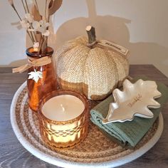 a white plate topped with candles and dishes