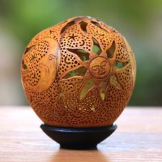 a decorative wooden object sitting on top of a table