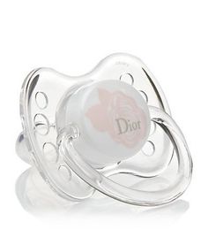 a baby pacifier with the word dior on it's side and an image of