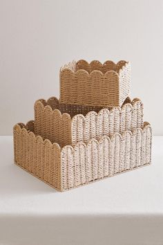 three wicker baskets stacked on top of each other