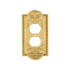 a decorative light switch cover in gold