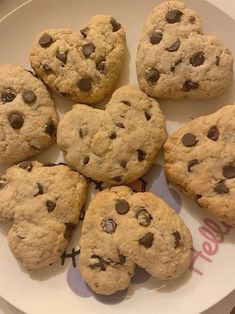 chocolate chip cookies arranged on a white plate