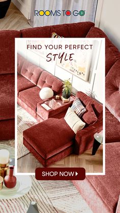 a living room with red couches and pillows on the floor next to a coffee table