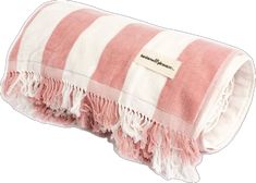 a pink and white striped blanket with fringes