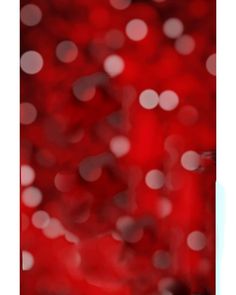 a blurry red background with white circles