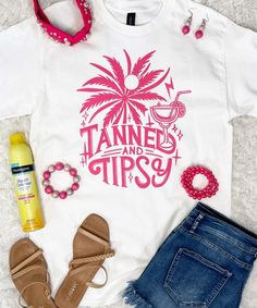 Introducing our "Tanned And Tipsy" Graphic Shirt, a playful and vibrant addition to your summer wardrobe. Featuring a striking hot pink design adorned with a palm tree motif, this shirt embodies the carefree and fun-loving spirit of summer.
Whether you're soaking up the sun on the beach, sipping cocktails by the pool, or dancing the night away at a beach party, our "Tanned And Tipsy" Graphic Shirt is the perfect choice for making a statement and embracing the joys of summertime. Available in sizes ranging from S to 5XL, there's a perfect fit for everyone to enjoy.
Made from premium-quality fabric, our shirt offers both comfort and style, ensuring that you feel confident and chic wherever your summer adventures take you. Whether you're pairing it with denim shorts for a casual day out or dr Hot Pink Design, Bride Workout, Black Friday Shirts, Beach Birthday, Black Friday Christmas, Pink Design, Fun Loving, Summer Adventures, Graphic Shirt