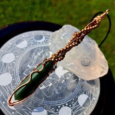 Green Jasper Magic Wand, Wire Wrapped Pendant, Copper Wire Wrapped Jewelry, Crystal Necklace, Witchy Gift for Her, Amulet, Talisman, Witchy Jewelry, Handmade Jewelry, Handcrafted Pendant.  *Please look at all pictures and all listing details before ordering.  *Wrapped with Premium Quality Tarnish Resistant Copper Wires. *Do not wear jewelry while showering, swimming or sleeping to preserve quality of jewelry. Avoid contact with perfumes or other harsh chemicals. *Crystals, gemstones and cabochons are subject to have natural imperfections due to their natural formation.  *Wire Wrapped Jewelry can be fragile, please handle your pendant or necklace with care.  *Each piece is uniquely created by hand. Therefore, minor blemishes, texture spots, or small imperfections might occasionally be prese Easy Wire Wrapping Stones, Green Jasper, Witchy Jewelry, Wire Wrapping Stones, Jewelry Crystal, Magic Wand, Wrapped Jewelry, Wrapped Pendant, Wire Wrapped Pendant