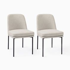 two chairs sitting side by side in front of a white background