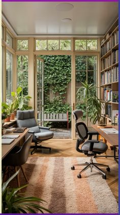 an office with large windows and lots of books on the shelves in front of it