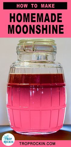 a jar filled with pink liquid sitting on top of a table next to the words how to make homemade moonshine