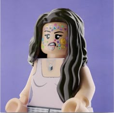 there is a lego figure with makeup on it's face and long black hair