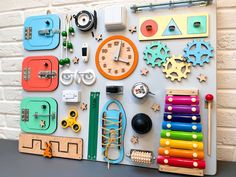 there are many different things on the wall with it's magnets and toys