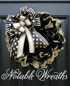 a black and gold polka dot mesh wreath on a door with the words, double wreaths