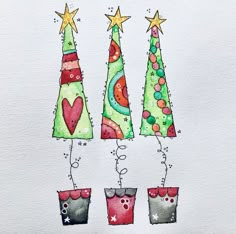 three christmas trees with stars on top