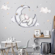 a child's room with an elephant sleeping on the moon and stars above it