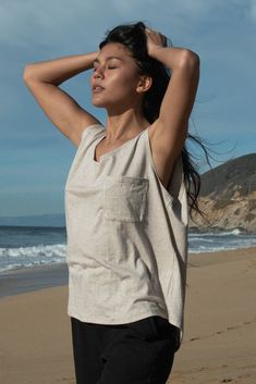 Boxy yet subtly revealing, the Label Muscle Tank is a "borrowed from the boys" wardrobe favorite. This oversized tank features a low scoop neckline and a low-side drape, complemented by an external label on the back for added style. Relaxed Scoop Neck Summer Tops, Summer Muscle Tee With Dropped Armholes, Casual Scoop Back Tank Top For Summer, Effortless Summer Tank Top For Loungewear, Scoop Neck Tank Top For Day Out, Summer Muscle Tee With Scoop Neck And Relaxed Fit, Summer Muscle Tee With Scoop Neck, Summer Relaxed Fit Muscle Tee With Scoop Neck, Relaxed Fit Scoop Neck Tank Top For Summer